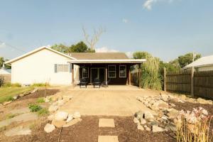 a house with a patio and a fence at The Family Haven - 3BD 3BA Home in East Peoria in West Peoria