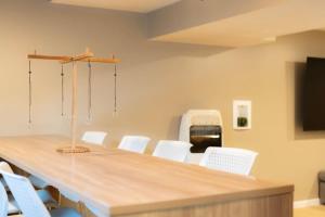 a conference room with a long table and white chairs at The Family Haven - 3BD 3BA Home in East Peoria in West Peoria