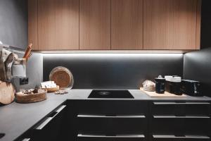 a kitchen with a stove and a counter top at Isard Homes by Select Rentals in El Tarter