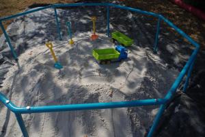 a toy playground in the snow with a train at CHEZ MITCH EN CAMPING CAR et grand espace extérieur in Caillavet