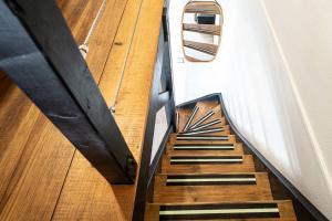 a staircase leading up to a room with a boat at Appartement Honoré in Saint-François