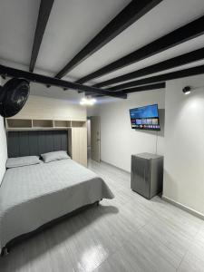 Ένα ή περισσότερα κρεβάτια σε δωμάτιο στο Hotel boutique Olaya 54