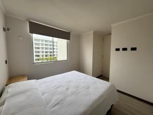 Postel nebo postele na pokoji v ubytování Depto La Serena + 9 fotografií