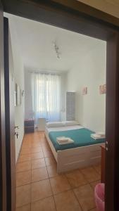 Postel nebo postele na pokoji v ubytování Meltin' Rome Guest House + 32 fotografií