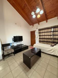 TV a/nebo společenská místnost v ubytování Takua del Lago