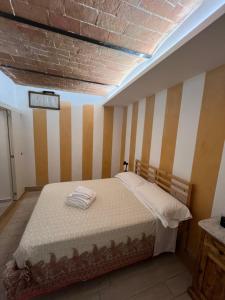 Ένα ή περισσότερα κρεβάτια σε δωμάτιο στο Rustico Valentina