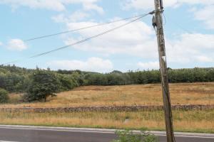 a telephone pole on the side of a road at The Miners Cottage in Wells
