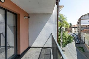 a balcony of a building with a view of a street at Elegance Rezidence in Arad