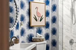 a bathroom with a picture of a flamingo on the wall at The Blue Bungalow - Peaceful, Porch, Hot Tub, Downtown in Orlando
