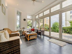 a living room with a couch and a table at 2 Bed in Bexhill-on-sea 95831 in Bexhill