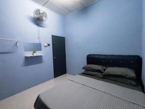 Ένα ή περισσότερα κρεβάτια σε δωμάτιο στο Munadibstay Dzul