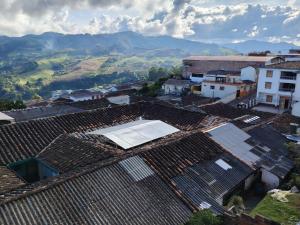 an overhead view of roofs with a tennis court on top at Hotel Posada La Porra in Concordia