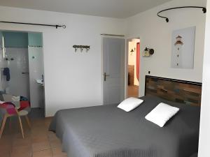 Postel nebo postele na pokoji v ubytování Gîte Du Midi - La Noria + 12 fotografií