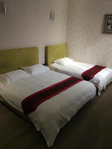 Postel nebo postele na pokoji v ubytování Igiban Hotel