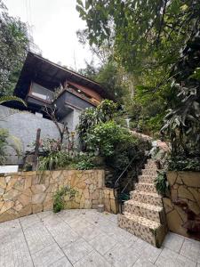 a set of stairs leading to a house at Casa da Oma in Blumenau +6 photos