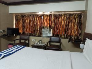 Ένα ή περισσότερα κρεβάτια σε δωμάτιο στο HOTEL GOLDEN PALACE PVT LTD