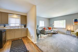 a kitchen and living room with a couch and a table at Pet-Friendly Wyandotte Apt Near Bishop Park! in Wyandotte