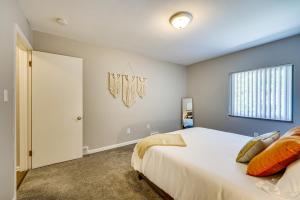 a bedroom with a large bed and a window at Pet-Friendly Wyandotte Apt Near Bishop Park! in Wyandotte