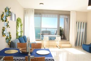 a living room with a view of the ocean at Beachfront Bliss 3 bedroom Privacy in Netanya