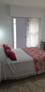 Ένα ή περισσότερα κρεβάτια σε δωμάτιο στο Minidpto +7 φωτογραφίες