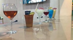 a group of wine glasses sitting on a table at Hotel Ruby in Agua Blanca Sur