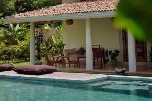 Πισίνα στο ή κοντά στο Mayava Villa