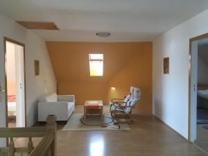 a living room with a couch and a chair at Holiday Home in Dobczyce near Ski Lift in Dobczyce