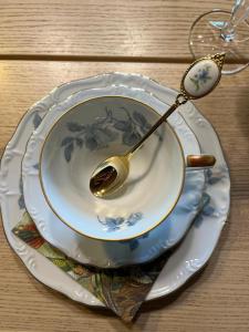 a spoon sitting on a plate on a table at Maison 1838  +17 photos