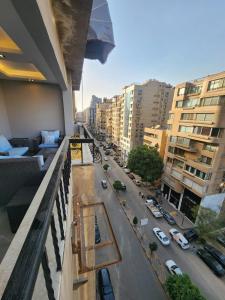 a view of a city street from a balcony at شقق فندقية بالقاهره in Banī Ghālib