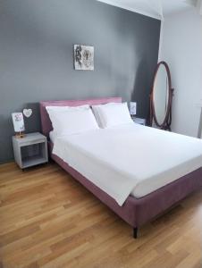 Ένα ή περισσότερα κρεβάτια σε δωμάτιο στο VM Ravenna Luxury Apartment