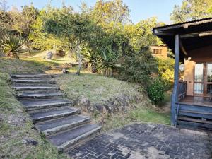 a set of stairs leading up to a house at Bush Willow Lodge in Hazyview