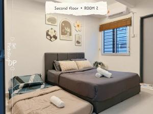 Ένα ή περισσότερα κρεβάτια σε δωμάτιο στο Familia Homestay 15pax 4R4B KL