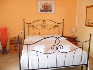 Postel nebo postele na pokoji v ubytování B&B Uliveto del Gargano