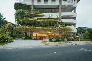 a building with a lot of plants on it at Kandy Myst by Cinnamon in Kandy