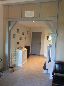a living room with a large wooden beam at Gite Les petits balcons in Pocé-sur-Cisse +20 photos