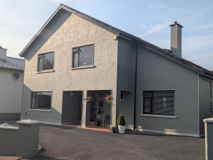 a large house with a gray at Station Road Homestay in Castlebar