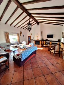 a living room with a couch and a table at La Cabaña de la Cigarra in Almodóvar del Río