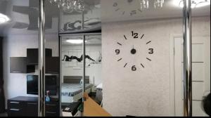 a large clock on a wall in a room at Lux apartment Central street in Mykolaiv