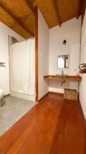 a bathroom with a sink and a toilet in a room at Terrazas Iguana in Máncora