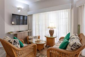 Μια τηλεόραση ή/και κέντρο ψυχαγωγίας στο Sea View Villa Cluster 63A- 2BR,Pool,Wifi,Golf +19 φωτογραφίες