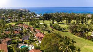 an aerial view of a resort with palm trees and the ocean at Keauhou Palena 901 in Kailua-Kona