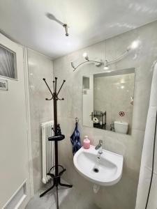 a bathroom with a sink and a mirror at Petaluda House 3 in Athens
