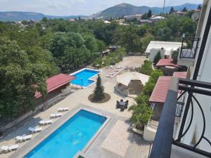 a view of a swimming pool on a balcony at Badam Hotel in Ganja