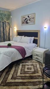 Ένα ή περισσότερα κρεβάτια σε δωμάτιο στο Cherry Guest House 1
