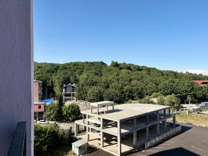 a view of a building with a mountain in the background at Siena Suite Tsaghkadzor in Tsaghkadzor