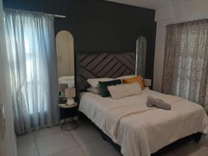 Ένα ή περισσότερα κρεβάτια σε δωμάτιο στο Cozy & Secure 2-Bedroom Retreat +19 φωτογραφίες