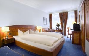 Postel nebo postele na pokoji v ubytování Post-Hotel
