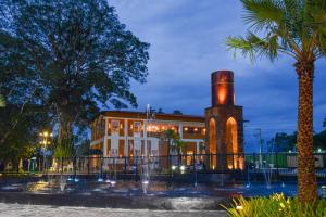 a building with a water fountain in front of it at Apartamento COP 30 in Ananindeua