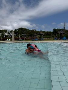 a person swimming in a swimming pool at Maison à Cabonegro in Cabo Negro +25 photos
