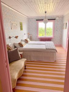Ένα ή περισσότερα κρεβάτια σε δωμάτιο στο Strömma Farmlodge B&B +10 φωτογραφίες